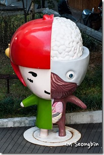Facts about the brain. Cartoon statue brain character. Multicoulours with doll body on one side and body inside on other half