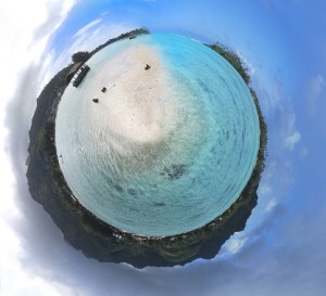 End of Life: A fish eye view photo of an island with sea and a small boat