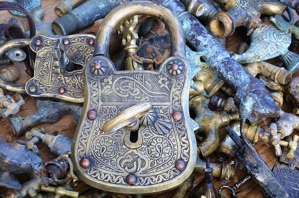 Privacy after brain injury. Photo of filigree padlock with key in it