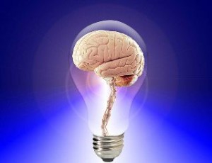Facts about the Brain. Blue background with brain inside lightbulb